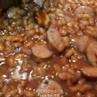 BBQ Baked Beans with grilled sausage. Also known as Bennie Weenies.