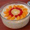 Ambrosia contains sour cream and/or sweetened whipped cream (or whipped topping) mixed with yogurt, pineapple, mandarin oranges and coconut.
